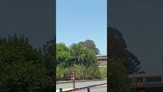 Train passes the Morayfield shopping centre on a sunny day [upl. by Kciderf]