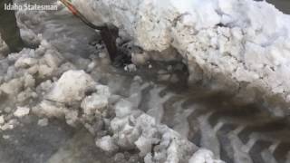 Clearing snow ice from Boise storm drains [upl. by So]