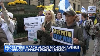 Protesters march in Chicago to oppose Russian President Putins war in Ukraine in global effort [upl. by Alvinia]