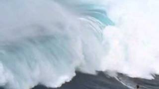 Surfing a Tsunami  Man surfs 65 killer wave  has the ride of his life survives JAWS MAUI [upl. by Dorman]