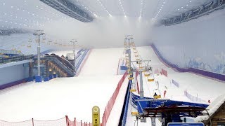 Worlds largest indoor ski resort opens in Chinas ice city [upl. by Lered]