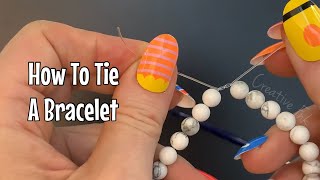 How to tie and elastic bracelet Simple and secure knot for beaded stretch bracelets [upl. by Noek383]