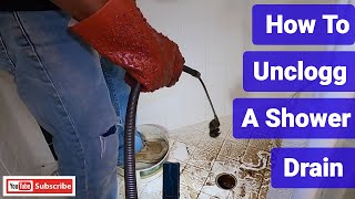 How To Snake Out A Shower Drain [upl. by Athalia]