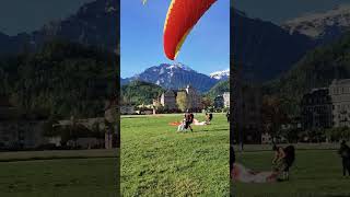 CloseUp Smooth Landing of Red and Orange Tandem Paraglider [upl. by Corny207]