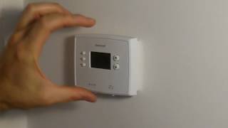 How to Change Batteries on Honeywell Thermostat RTH2300 RTH221 [upl. by Ulane]