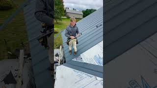 Roofing crew installing Textured Sea Slate Legacy Rib Metal on beautiful home Roofing [upl. by Yelrah]