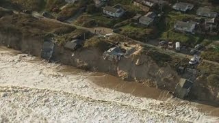 Worst tidal surge in 60 years batters UK east coast and drags homes into the sea [upl. by Nocaj]