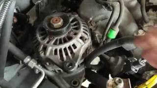 How to remove the alternator out of the engine bay 2001 2002 2003 Mazda Protege [upl. by Annairdna]