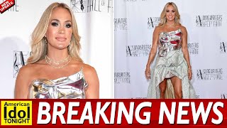 Carrie Underwood flashes her legs in glitzy high low gown with a silver chrome chest plate as she le [upl. by Najar]