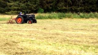 Having a go of turning hay with a Fordson E27N P6 [upl. by Germayne934]