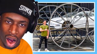 REACTING TO Driving A Tesla UpsideDown 10ft Tall Wheels [upl. by Aicnerolf]