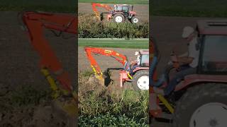 How a ditch is dug with a tractor and excavator arm with New Holland L85 excavator Negrisolo [upl. by Solracnauj]