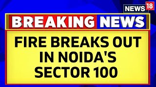 Noida Fire News  Fire Breaks Out In Noidas Lotus Boulevard Society In Sector 100 In UP  News18 [upl. by Nyla]