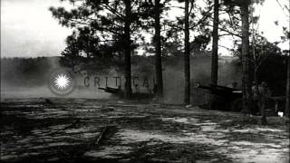 US Marine Artillery Battery firing 105mm howitzers Buildings being destroyed by HD Stock Footage [upl. by Jessika]