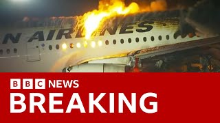 Japan Airlines plane in flames on the runway at Tokyos Haneda Airport BBC News [upl. by Doone]