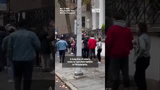 A long line of voters waits to cast their ballots in Philadelphia [upl. by Allerus]