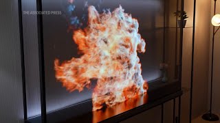 At CES LG unveils ‘world’s first’ wireless transparent OLED TV [upl. by Halbeib]