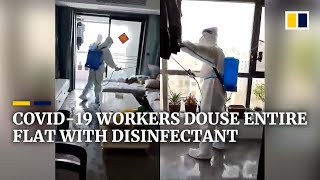 Covid19 workers in China douse entire flat with disinfectant while owner is away [upl. by Basilius]