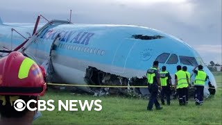 Korean Air plane overshoots runway at Philippines airport [upl. by Nhtanhoj]