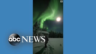 Skiers enjoy aurora borealis in Finland [upl. by Refinneg340]