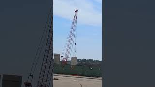 Crane lifting section of wall for New Woodmans Grocery Store [upl. by Sachs]