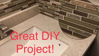 Installing a Glass Mosaic Tile Backsplash in the Bathroom [upl. by Tebzil]