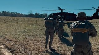 A group of US Army Rangers perform an air jump from a UH60 Black Hawk helicopter [upl. by Teodorico836]