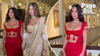 Kim and Khloé Kardashian sparkle in traditional Indian outfits at Ambani wedding [upl. by Macnamara810]