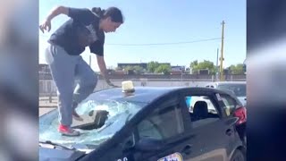 Woman jumps on taxi and smashes through windshield in Winnipeg [upl. by Nutter953]