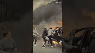 WHOA Good Samaritans save driver from burning car [upl. by Doowyah]