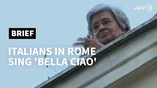 Italians in Rome sing Bella Ciao as virus lockdown continues  AFP [upl. by Amahcen702]