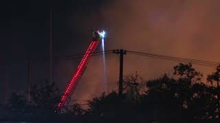 Fire crews in Texas battle pallet fire near Love Field Airport [upl. by Einoj]