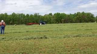 Kuhn SR 310 Wheel Rake under New Holland power 2013 NC Hay Day [upl. by Iaht]