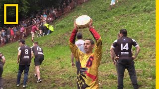 Watch a Downhill CheeseChasing Competition in Britain  National Geographic [upl. by Wesle]