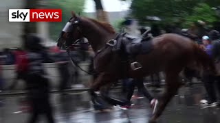 Officer knocked off horse during clash with BLM protesters in London [upl. by Eeramit]