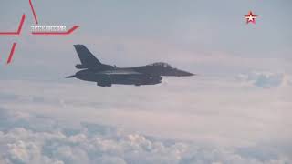 Exclusive footage Su27 fighter drives NATO F16 away from Shoigu aircraft [upl. by Natam954]