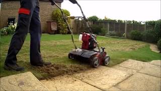 SCARIFYING MOSS AND THATCH OUT OF A SMALL LAWN [upl. by Muriel]