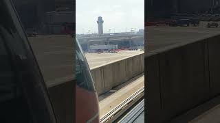 Here comes the DFW Skylink Train skytrain dfw airport dallas texas [upl. by Annel]