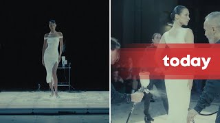 Fashions future Bella Hadid has dress sprayed on her live at Coperni show [upl. by Tri467]