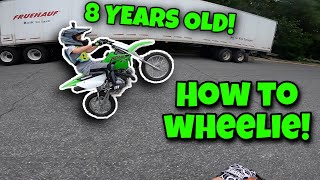 TEACHING 8 YEAR OLD LILMAN HOW TO WHEELIE A DIRTBIKE [upl. by Pepito855]