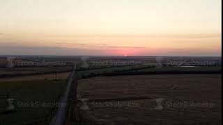 Aerial view of rural road passing through agricultural land and cultivated fields Footage Concept [upl. by Carson]