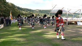 Massed Pipes amp Drums return march after the 2018 Ballater Highland Games in Deeside Scotland [upl. by Bonn508]