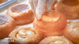 Hundreds Of LecheFlanFilled Doughnuts Are Made In A New York Apartment [upl. by Sone]