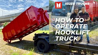 HOW TO OPERATE A HOOKLIFT TRUCK  ISUZU NPR70 ROLL ON ROLL OFF HOOKLIFT BODY WITH 14 FEET STEEL BIN [upl. by Nena]