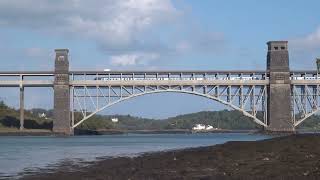 Avanti train crosses eastwards on iconic Britannia Bridge over Menai Strait MonGwynedd CymruWales [upl. by Thill]