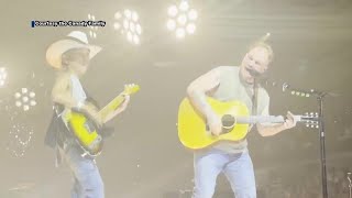 Country star Zach Bryan invites Midlands teen onstage for duet after seeing sign asking to play [upl. by Nahsin184]