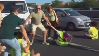 Furious drivers physically drag activists off a busy highway [upl. by Hwang]