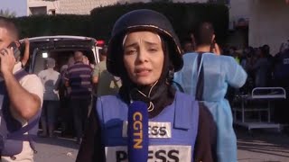 CGTN correspondent breaks down in tears while reporting in Gaza [upl. by Allimak713]