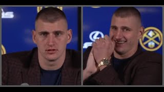 Nikola Jokic tries to keep it together after a camerawoman fell off her chair [upl. by Erskine]