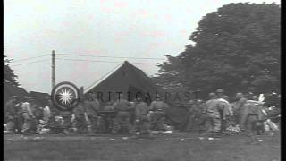 US soldiers of 4th Infantry Division sort life belts at a tent camp in Torquay prHD Stock Footage [upl. by Mahla]